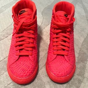 Red. Nike high top rubber sneakers. Women’s size 9.
